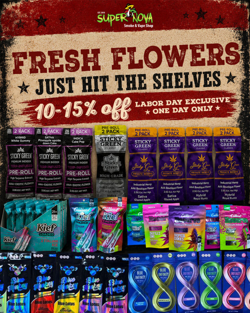 Storefront display of cannabis products with a bold banner announcing a Labor Day sale from Super Nova Smoke & Vape Shop: 10-15% off, one day only, 'Fresh Flowers Just Hit the Shelves'.